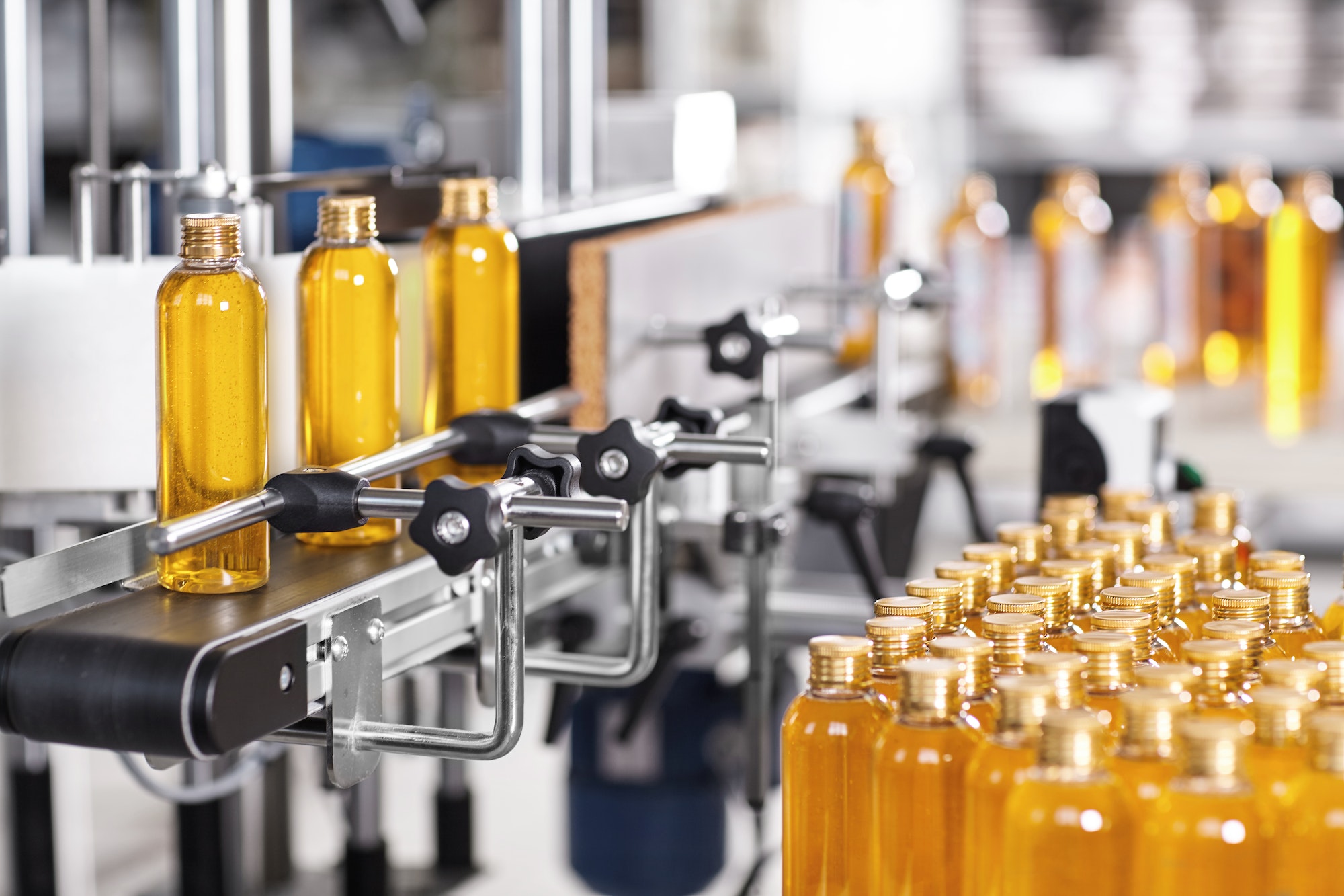 Production line of beauty and healthcare products at plant or factory. Process of manufacturing and